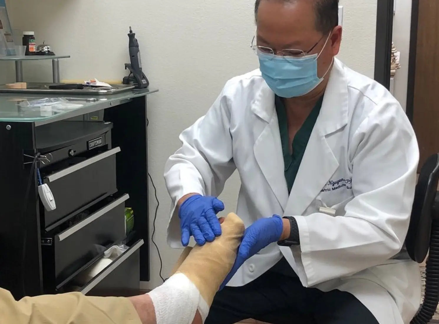 Dr. Tim Nguyen fitting an orthotic in his clinic